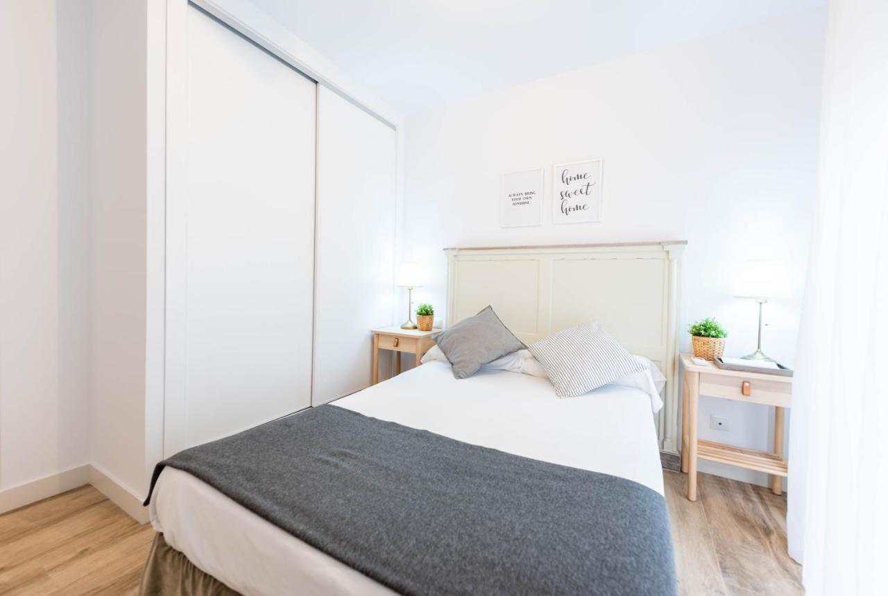 Apartamentos Toboso Plaza Nerja Exterior photo A bedroom with a sliding wardrobe