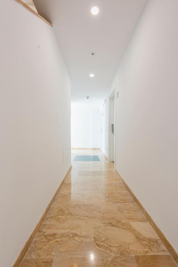 Apartamentos Toboso Plaza Nerja Exterior photo A corridor