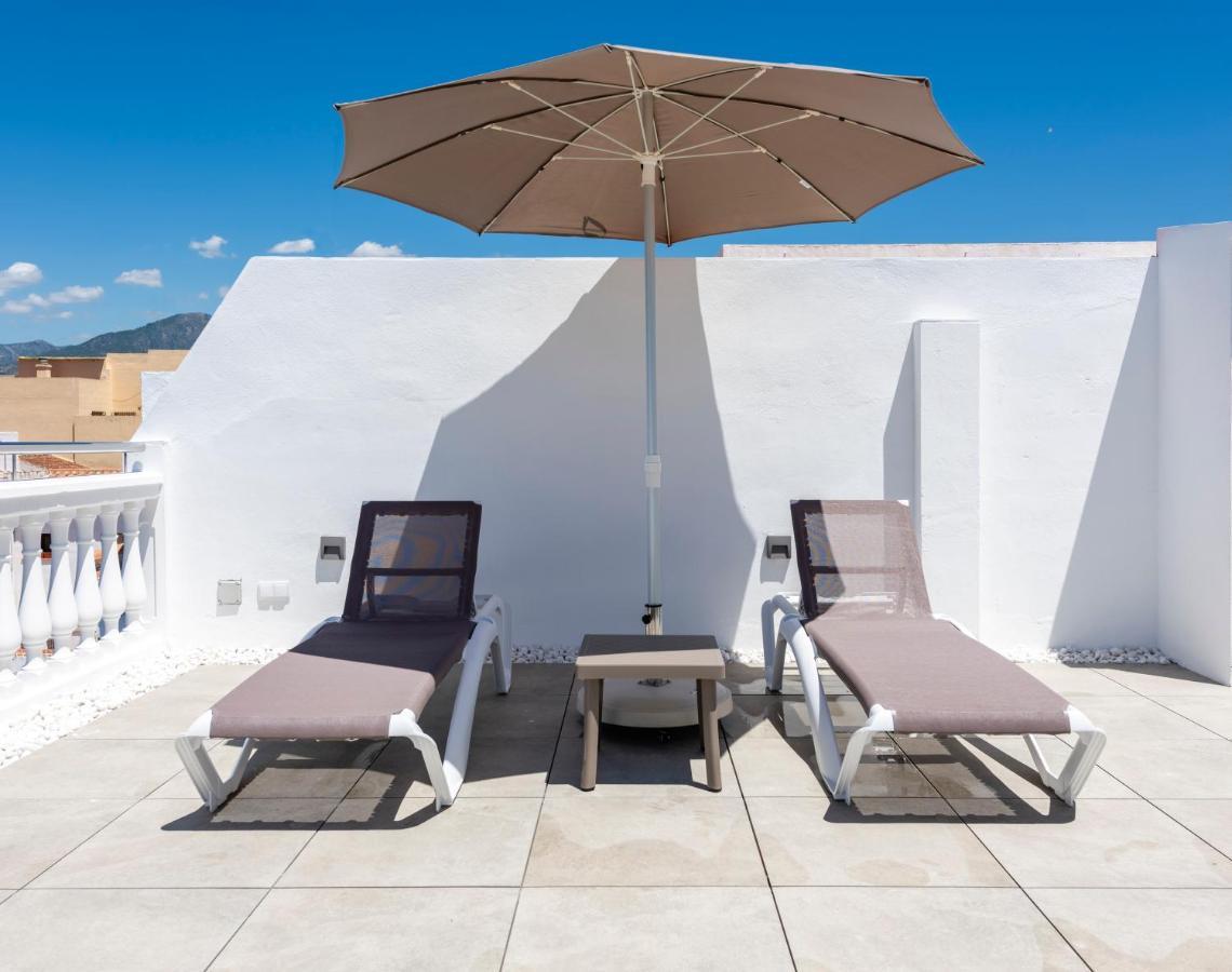 Apartamentos Toboso Plaza Nerja Exterior photo A patio umbrella